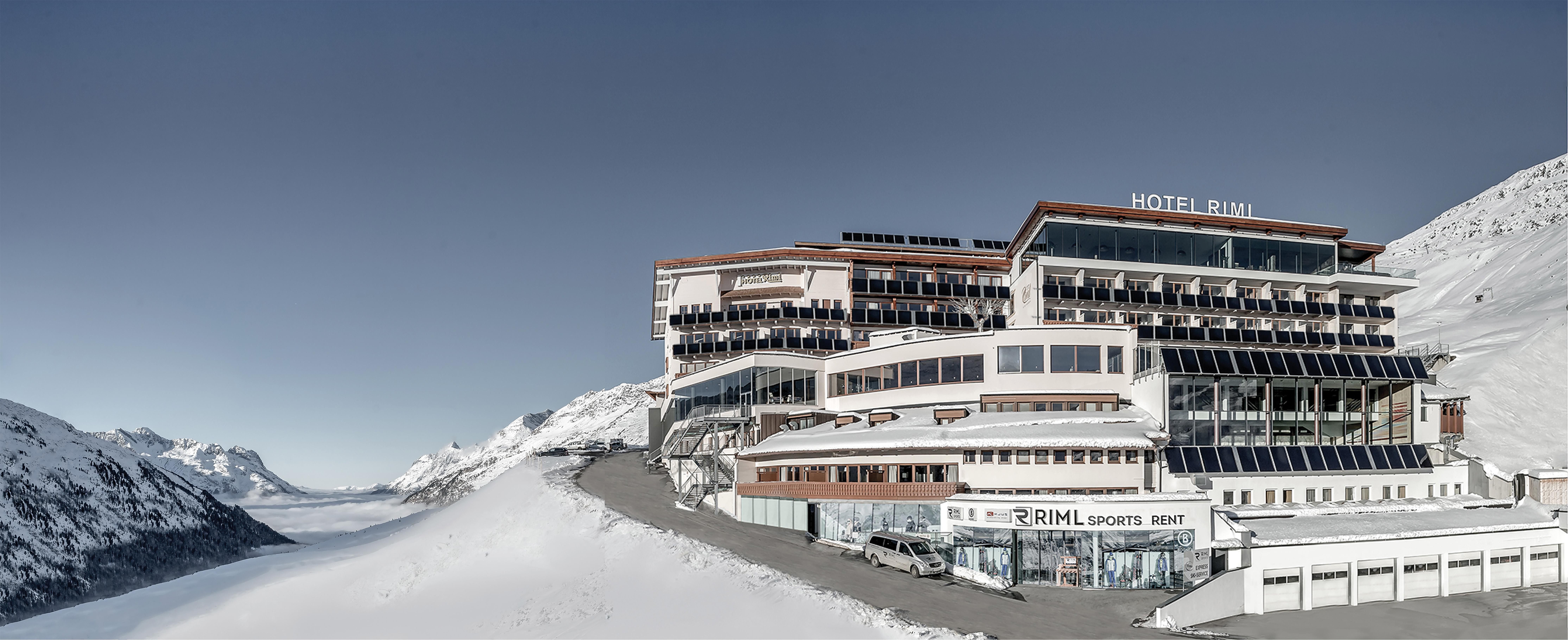 A modern hotel in snow-covered mountains. The clear winter landscape offers a breathtaking view.